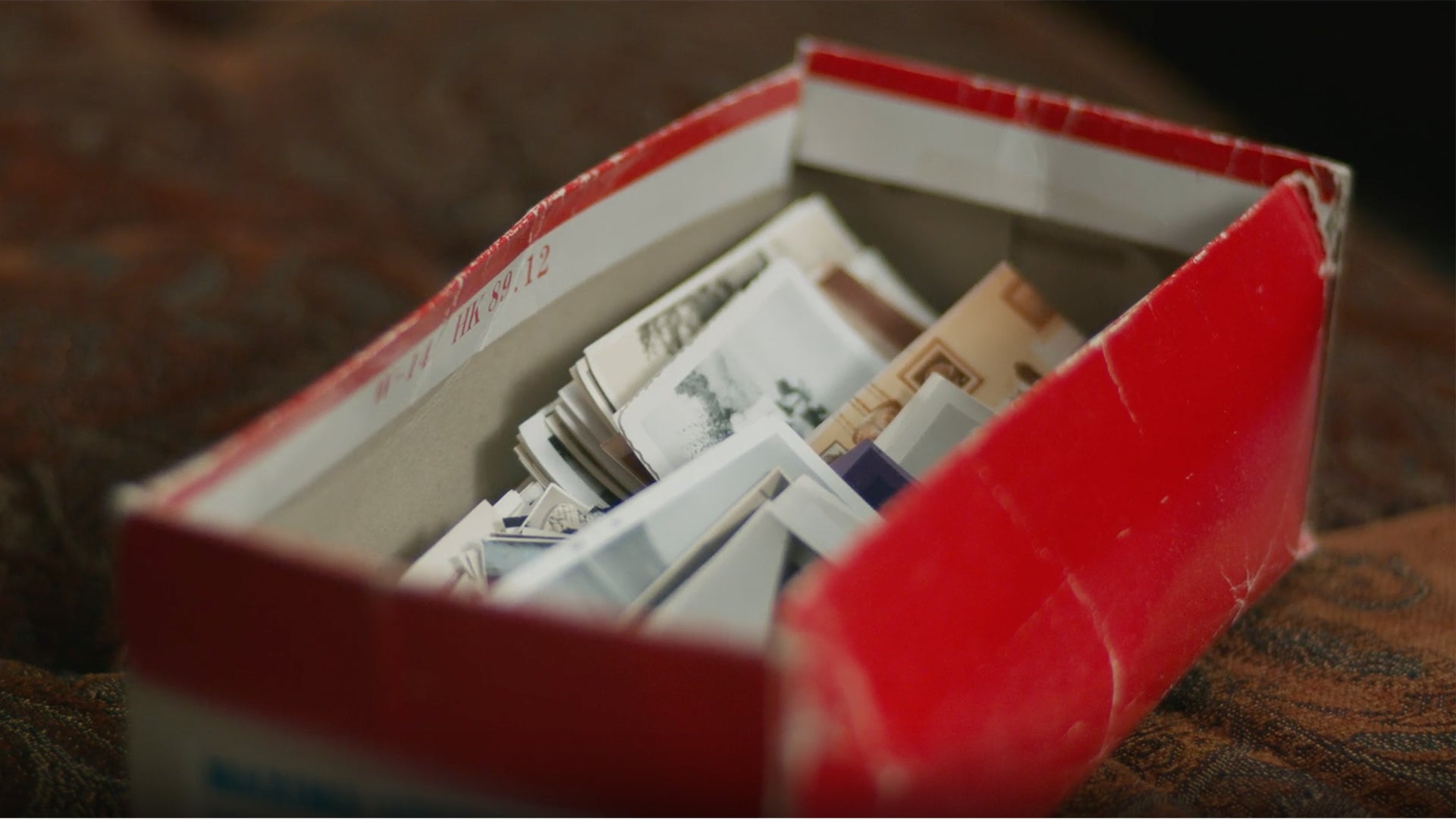 A shoebox full of old photos.