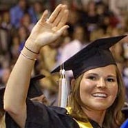 Girl waving at commencement