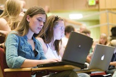 students using laptops in class