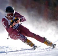 DU Pioneer Florence Roujas competes in downhill skiing