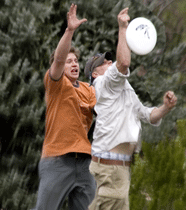Students playing frisbee.