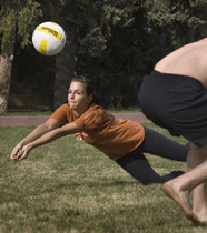 Students playing volleyball.