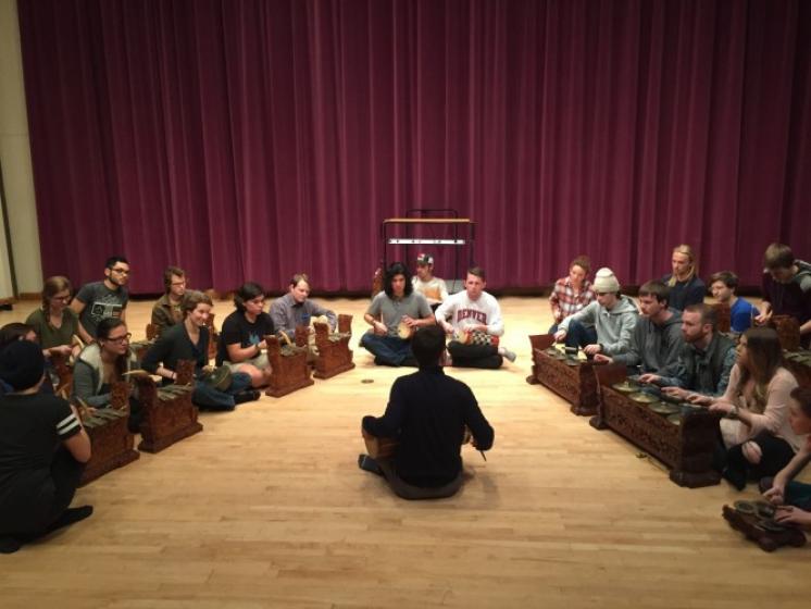 Aaron Paige's class participates in a hands-on workshop with a bronze gong gamelan orchestra