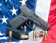 picture of gun on the American flag