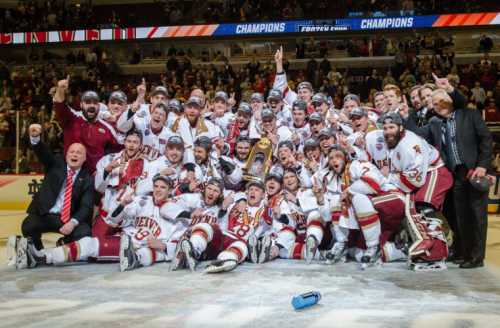 The Pioneers celebrate on the ice in Chicago after winning last year's national championship