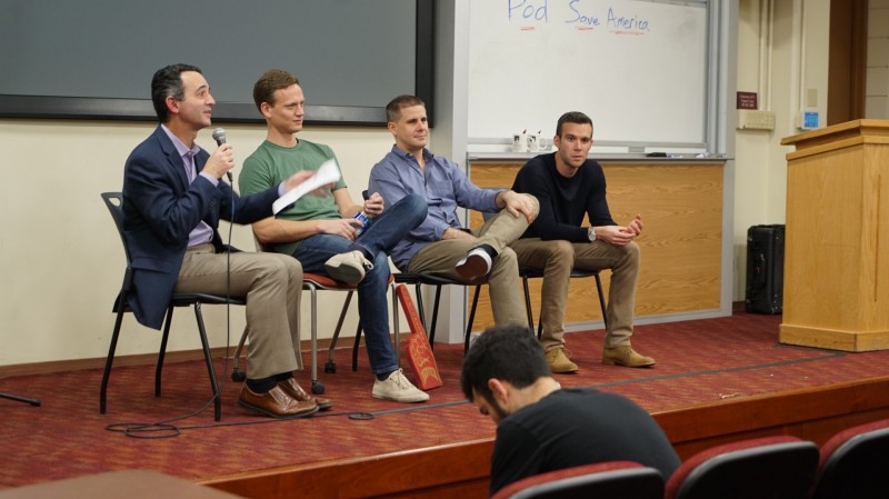 Professor Seth Masket, left, facilitates a discussion with Pod Save America hosts Tommy Vietor, Jon Lovett and Jon Favreau. (Photo: Justin Beach)