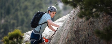 a student climbing at kmc