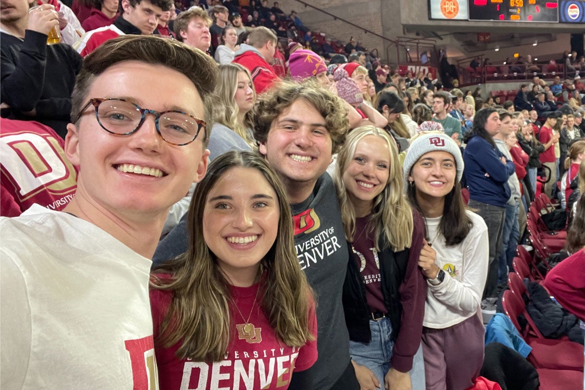 DU students posing together at sporting event