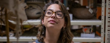 a student looking up at archaeology lab