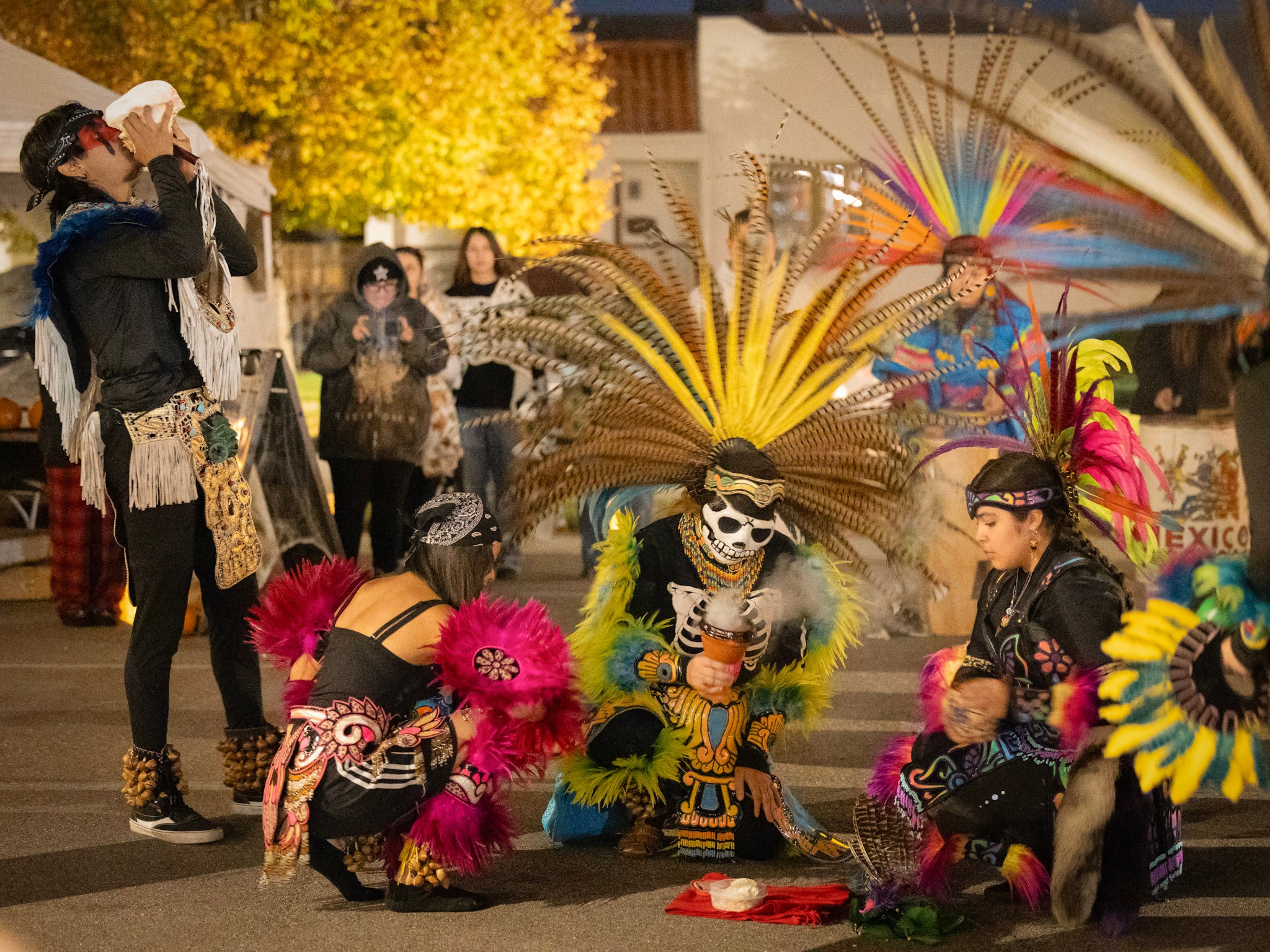 people perform at Día de los Muertos celebrations