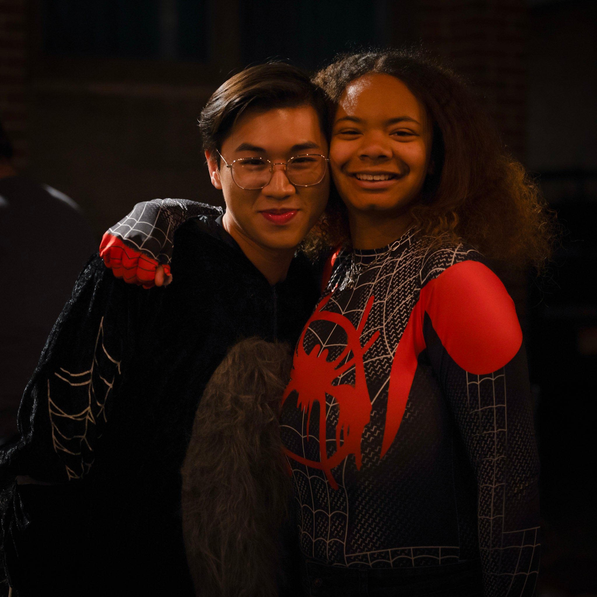 two students dressing in spider man costume
