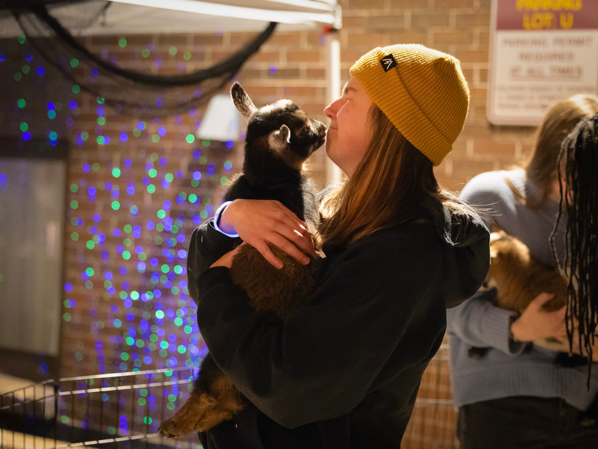 a student kisses her dog