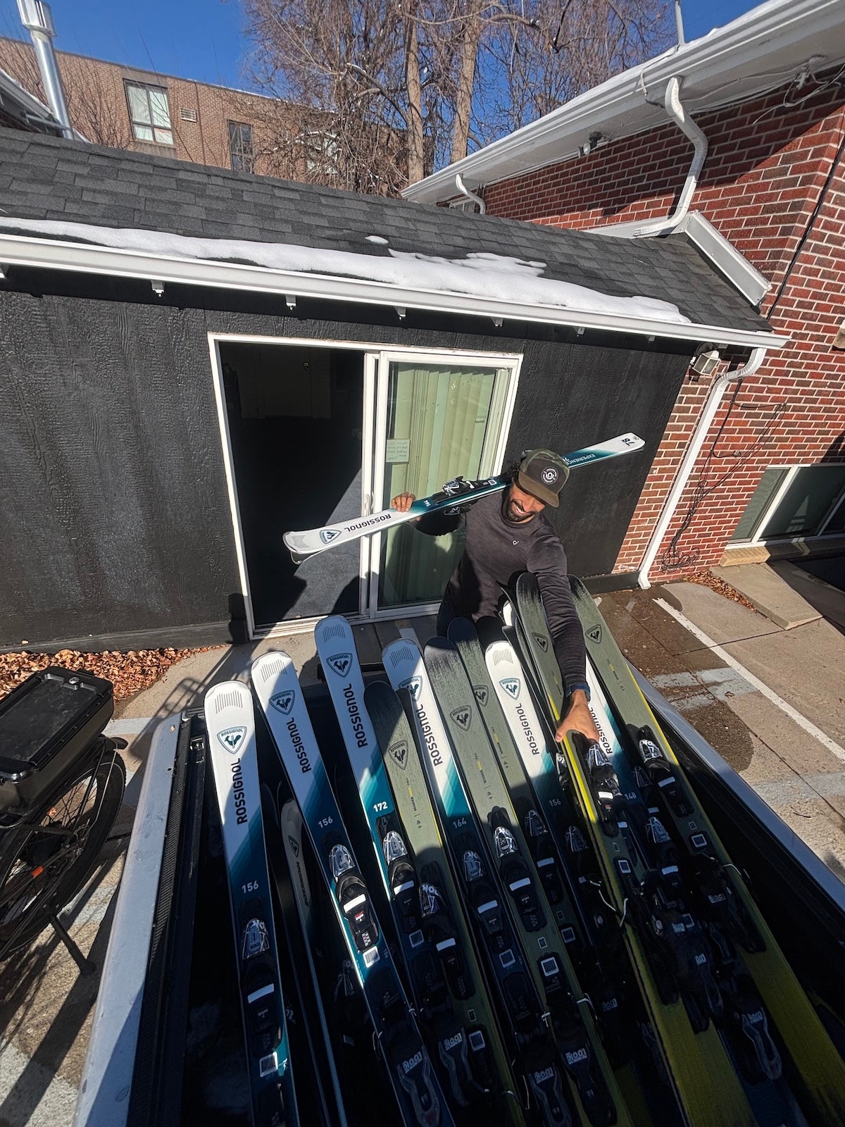 a person arranges ski gear at ski shop