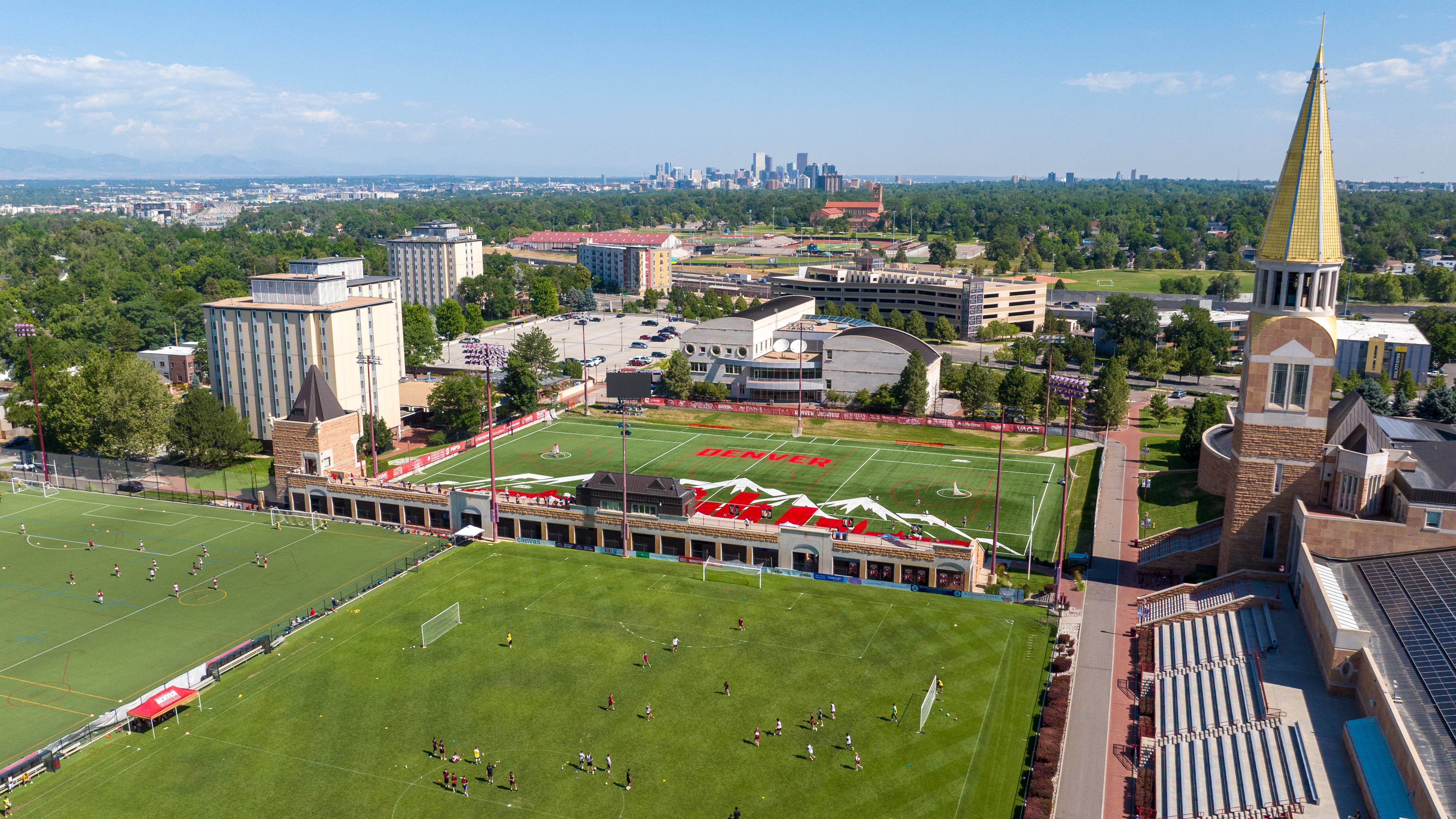 Lacrosse field aerial with view toward downtown Denver