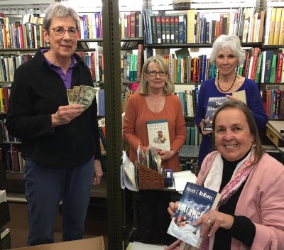 Volunteers from the Book Stack worked to provide donations to a library for parolees