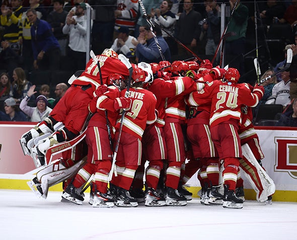 DU hockey celebrates its semifinal victory against Boston University.