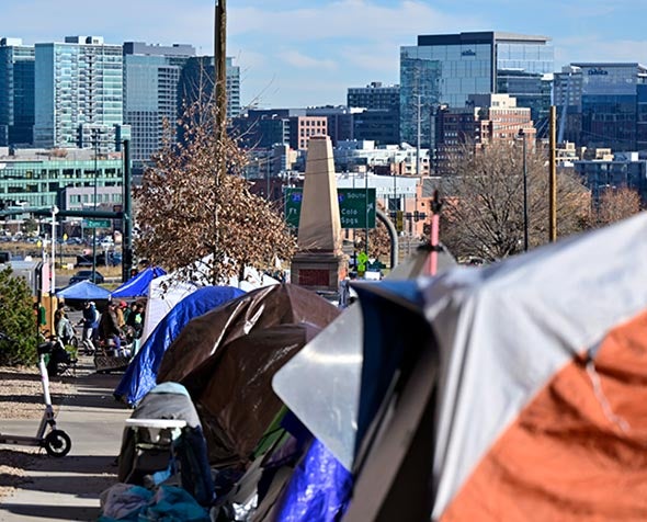row of tents overlooking denver city centre 