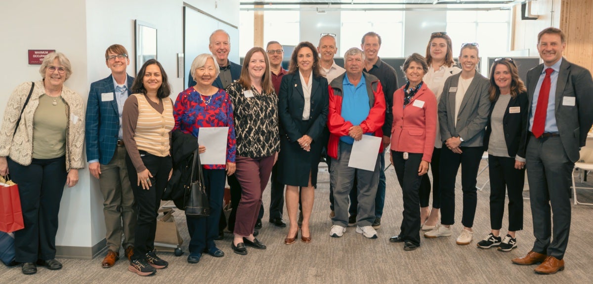 bb8c59ca-846a-443f-88e1-9c5f5b5a9c11.jpg Group of people smiling.