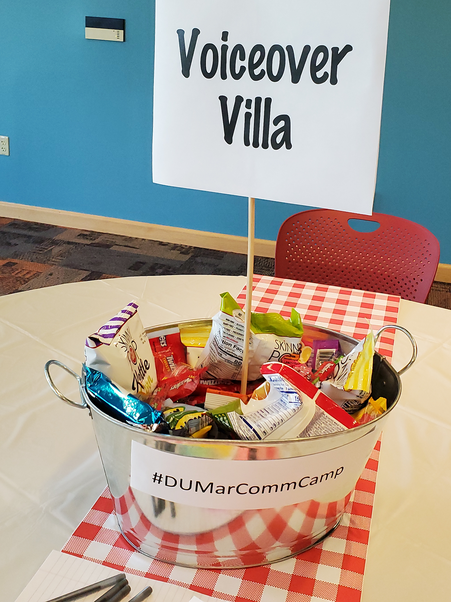 bucket of snacks with a sign that says "voiceover villa"