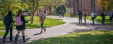 scenic of students walking on campus pathways