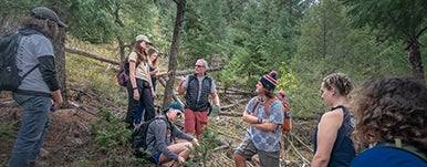group of students and teacher in wilderness