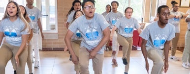 students dance in sync