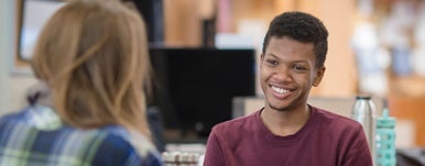 two students in friendly conversation