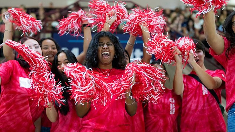 student volunteers cheering on move-in day