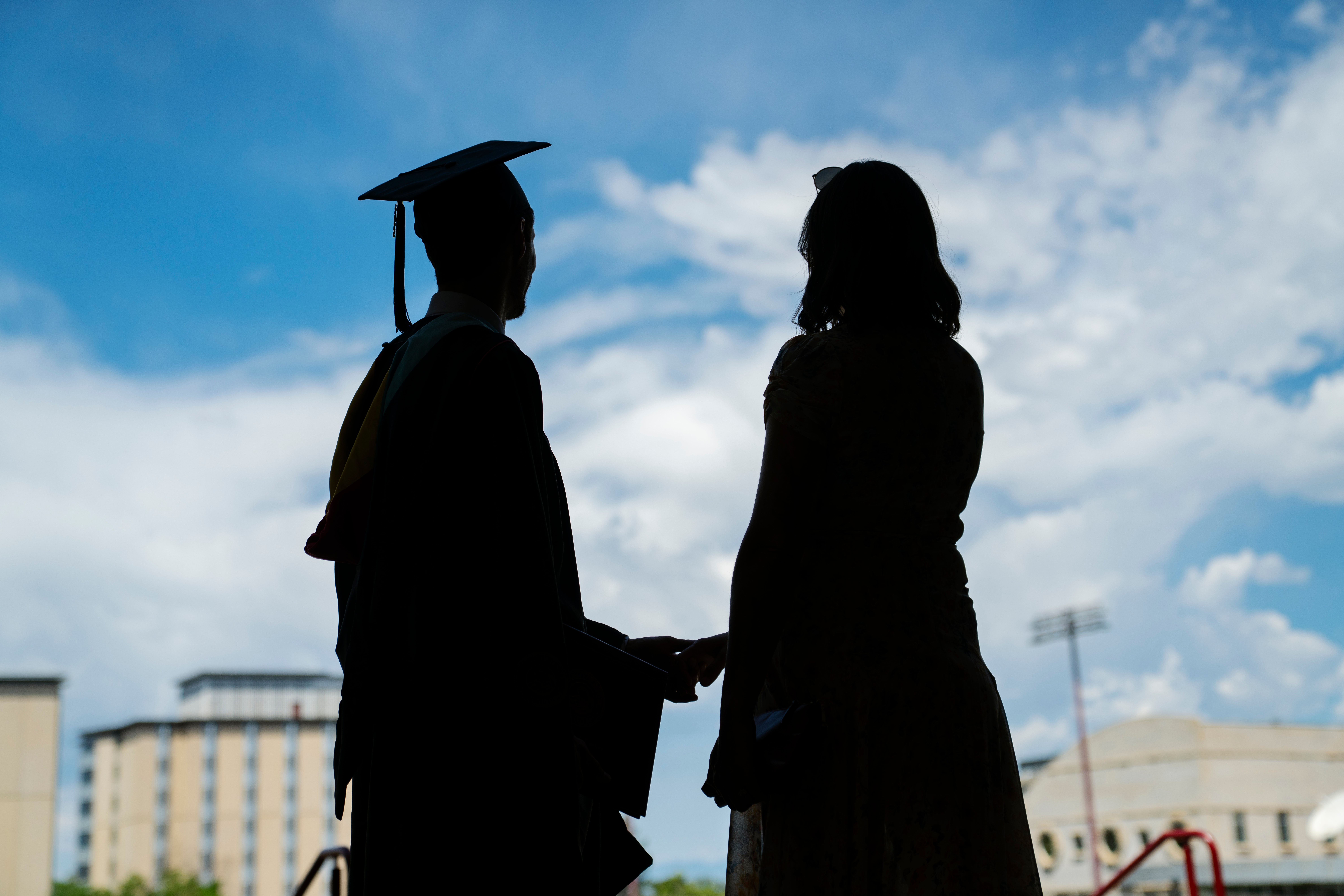a graduate shaking hands