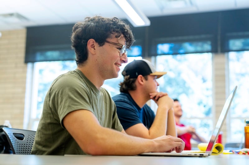 two students in Korbel classroom