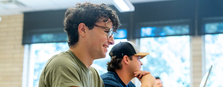 two students in Korbel classroom