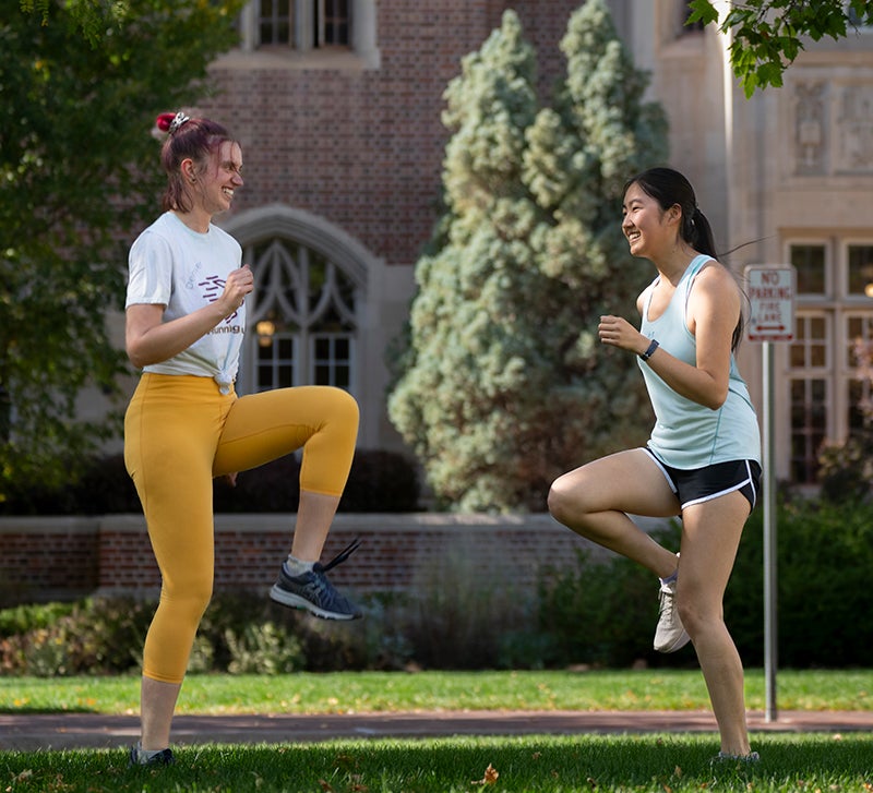 two students getting ready to run