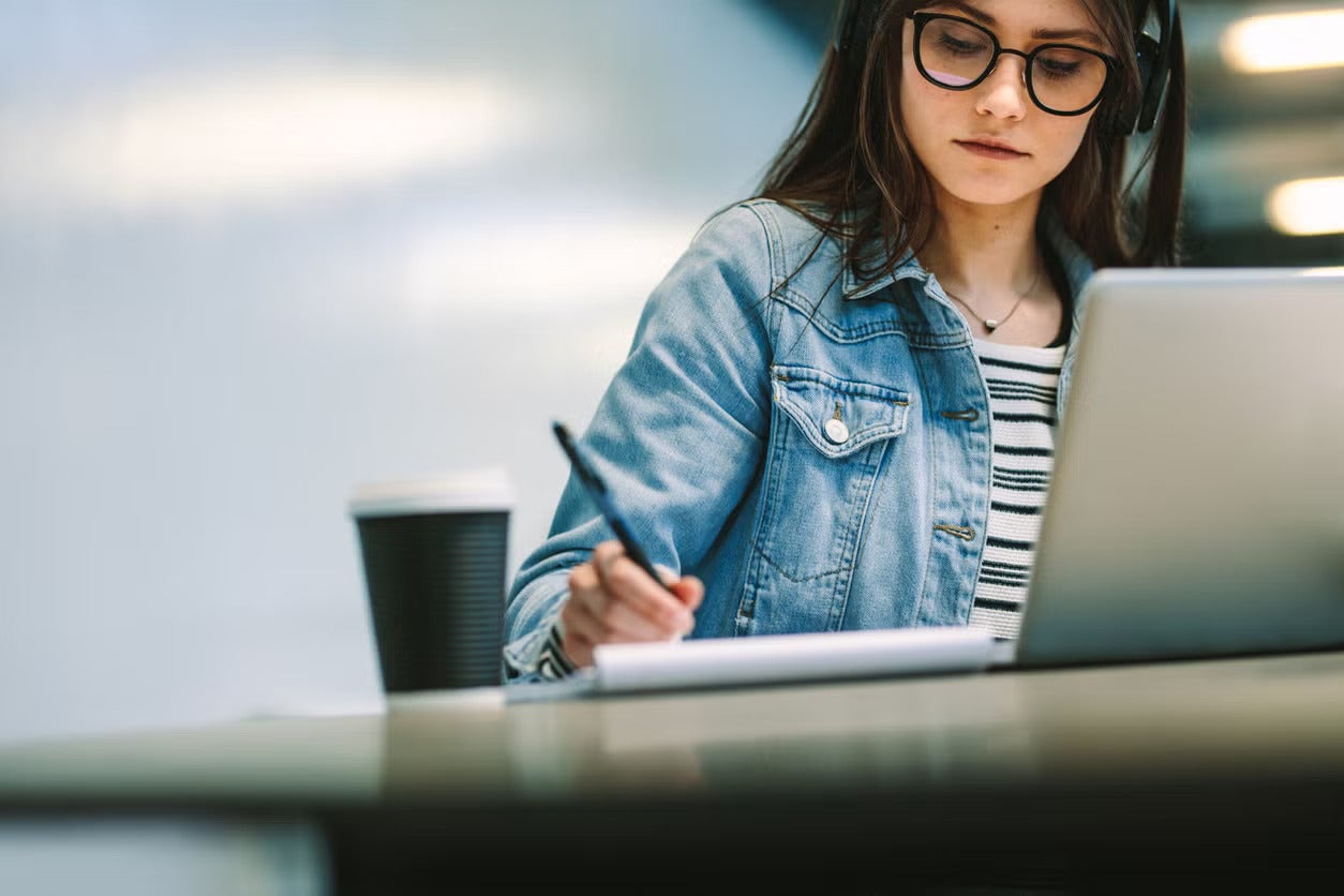 female-student-at-compuer-w-coffee