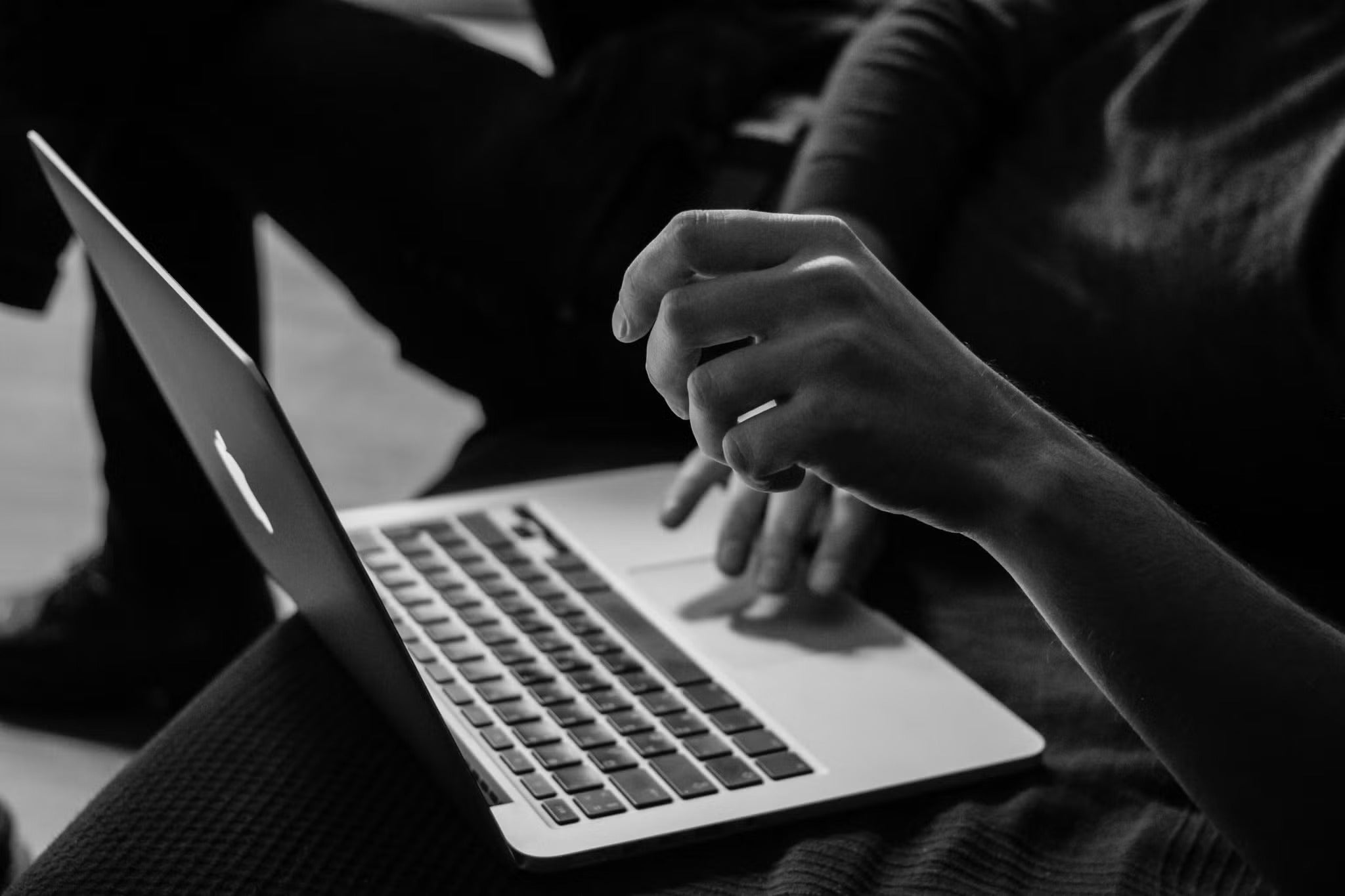 hands working on a laptop