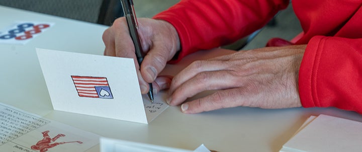 a person writing letter