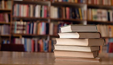 Stack of books on a desk 