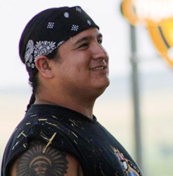 Nick Tilsen headshot in shirt sleeves