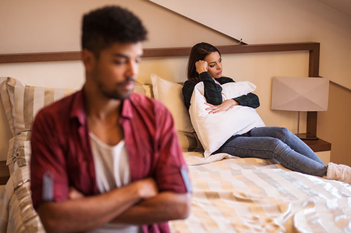couple upset on bed