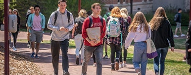 students walk between classes