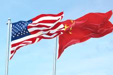 USA and China flags blowing in the wind