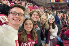 DU students posing together at sporting event