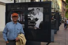 Rick Moulton stands before a poster of his new documentary