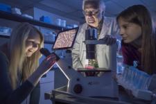 Robert Dores and two students