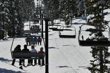 Skiers on a chairlift