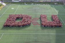First-year students form DU on the field