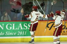 Hockey players celebrating a goal