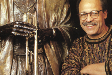 Ed Dwight next to his work