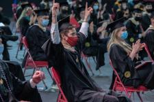 Graduates cheering at ceremony