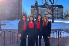Four students pose for a photo after winning the National Diversity Case Competition
