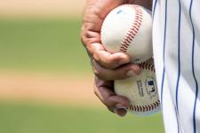 Pitcher holding baseballs